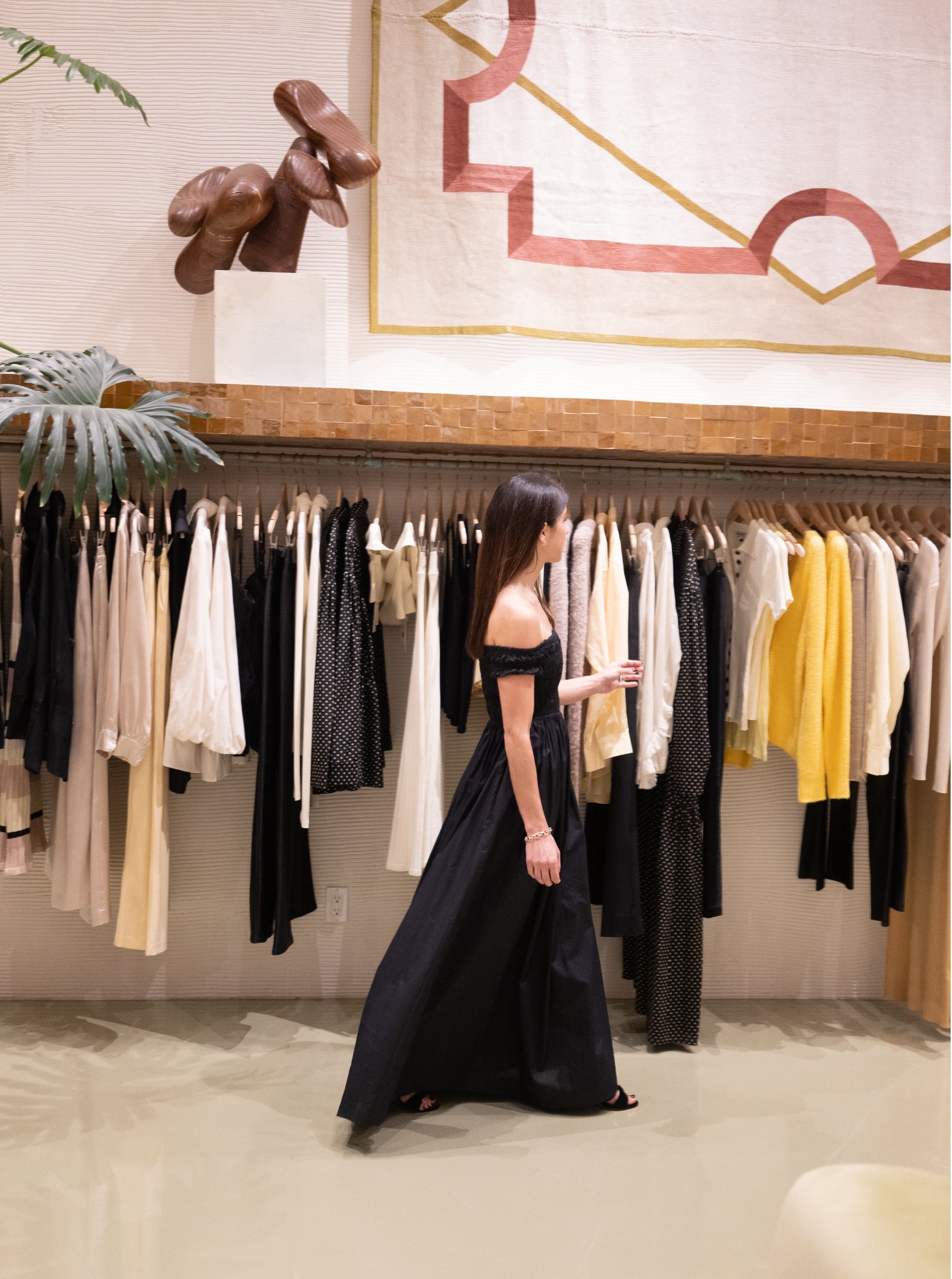 woman in a black dress in clothes store